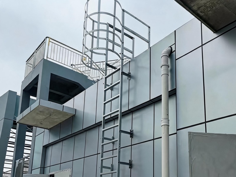 Cage ladder on modern building facade